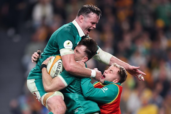 Ireland celebrate Hugo Keenan’s try.