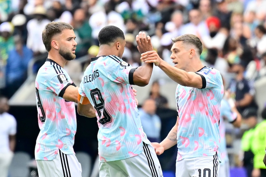 Leandro Trossard and Youri Tielemans argue with each other on the pitch