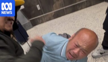 Australian man Phu Nguyen handcuffed by plain-clothes ICE agents at Las Vegas International airport