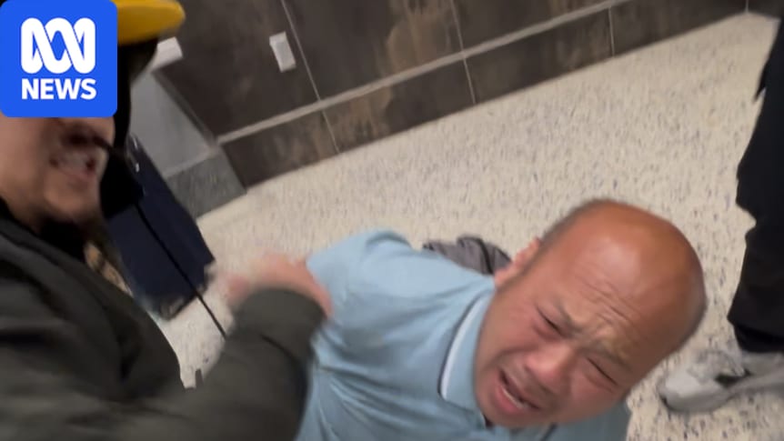 Australian man Phu Nguyen handcuffed by plain-clothes ICE agents at Las Vegas International airport