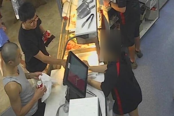 CCTV footage shows two men ordering from Weipa bakery.
