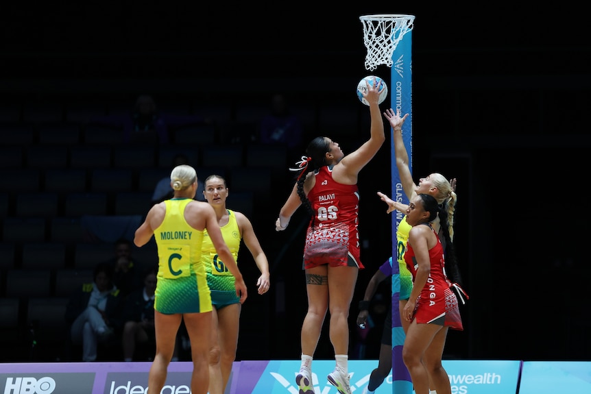 Tonga goal-shooter Uneeq Palavi jumps for the ball against Australia at the Glasgow 2026 Commonwealth Games.