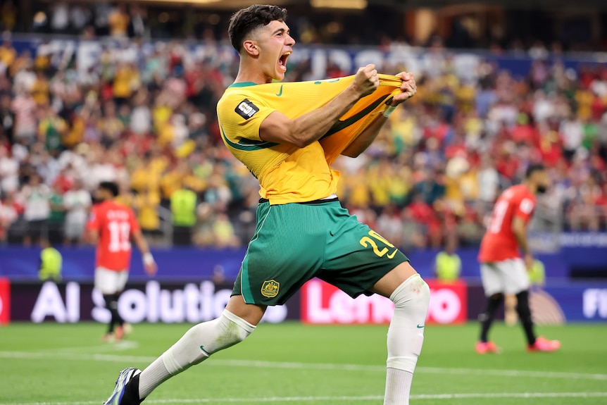 Cristian Volpato grabs his jersey in celebration
