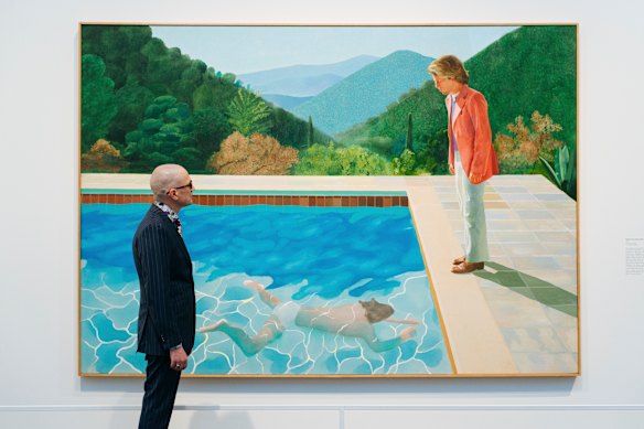 A viewer looks at David Hockney’s Portrait of an Artist (Pool with Two Figures), which set a record for a work sold at auction by a living artist in 2018.