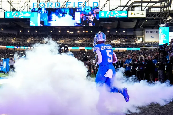 Detroit Lions running back David Montgomery (5) runs out of the tunnel during players introduction before the first half against Tennessee Titans at Ford Field in Detroit on Sunday, Oct. 27, 2024.