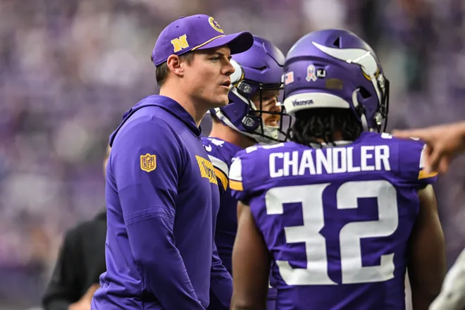 Dec 1, 2024; Minneapolis, Minnesota, USA; Minnesota Vikings head coach Kevin O'Connell talks with running back Ty Chandler (32) before the game against the Arizona Cardinals at U.S. Bank Stadium. Mandatory Credit: Jeffrey Becker-Imagn Images