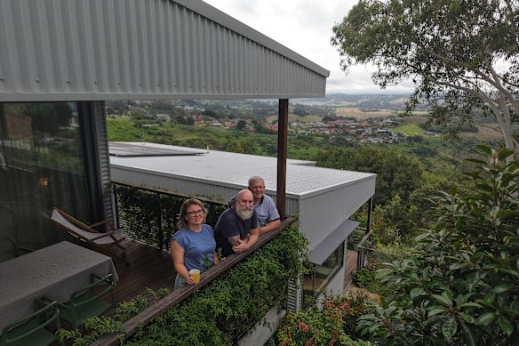 Sara Pearson with her father, Allen, and partner Craig Bennett. Sara has designed two homes on one block.