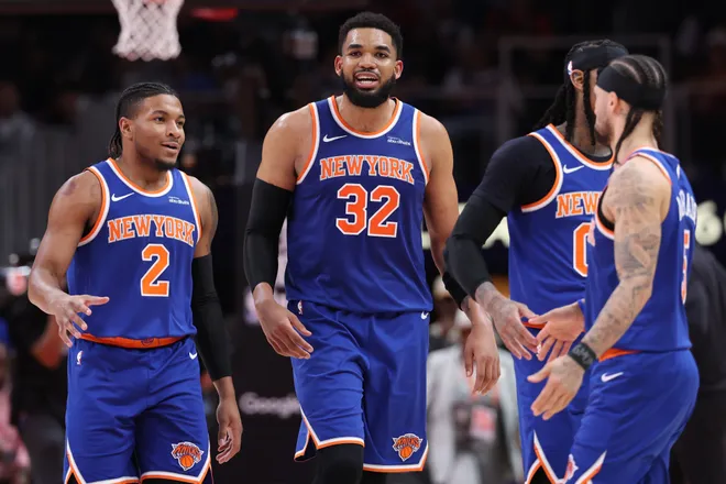ATLANTA, GEORGIA - APRIL 30: Karl-Anthony Towns #32, Miles McBride #2 and Jose Alvarado #5 of the New York Knicks reacts to the score during the third quarter of a game against the Atlanta Hawks in Game Six of the First Round of the NBA Eastern Conference Playoffs at State Farm Arena on April 30, 2026 in Atlanta, Georgia. NOTE TO USER: User expressly acknowledges and agrees that, by downloading and or using this photograph, User is consenting to the terms and conditions of the Getty Images License Agreement. (Photo by Kevin C. Cox/Getty Images)