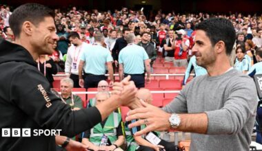 Xabi Alonso, Head Coach of Bayer 04 Leverkusen, interacts with Mikel Arteta, Manager of Arsenal, prior to the pre-season friendly match between Arsenal and Bayer 04 Leverkusen at Emirates Stadium