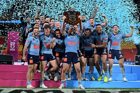 Blues skipper Isaah Yeo holds up the Origin shield.