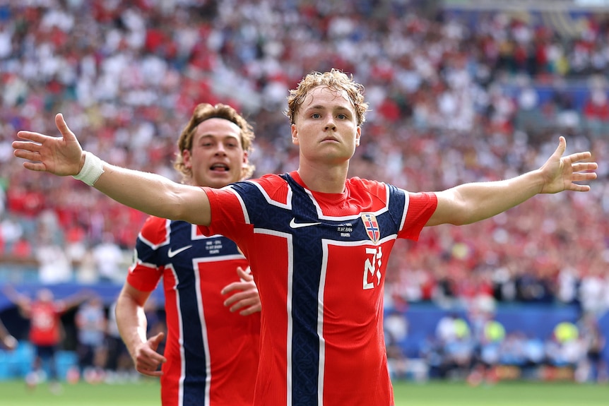 Andreas Schjelderup celebrates with his arms outstretched
