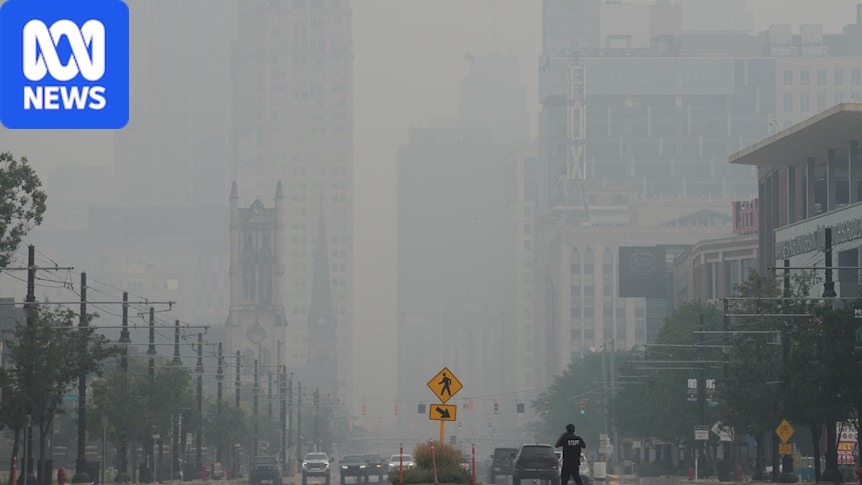 Smoke from Canada wildfires crosses into US prompting warnings to stay indoors