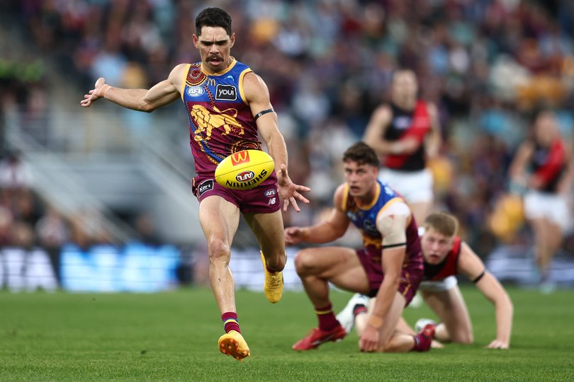 Charlie Cameron of the Lions kicks.