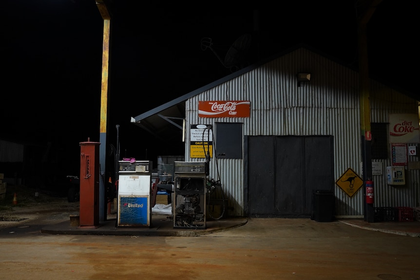Old pieces of equipment show the age of a roadhouse, with paint peeling off signs after years of exposure to harsh weather.
