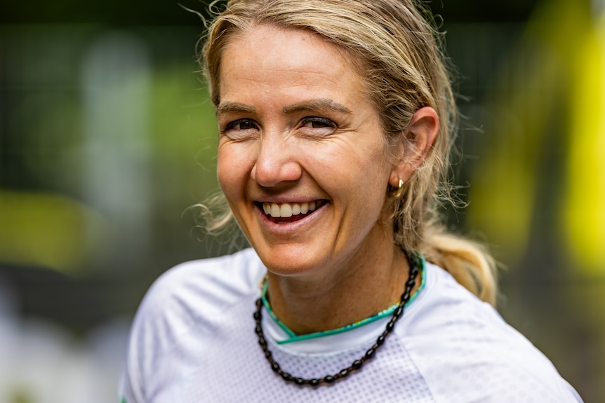 Lauren Reynolds smiles in a t-shirt