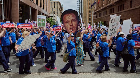 Nurses and midwives march through Sydney’s CBD during one of three statewide strikes in 2024.