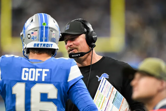 Nov 2, 2025; Detroit, Michigan, USA; Detroit Lions head coach Dan Campbell speaks with quarterback Jared Goff (16) in the third quarter against the Minnesota Vikings at Ford Field. Mandatory Credit: Lon Horwedel-Imagn Images