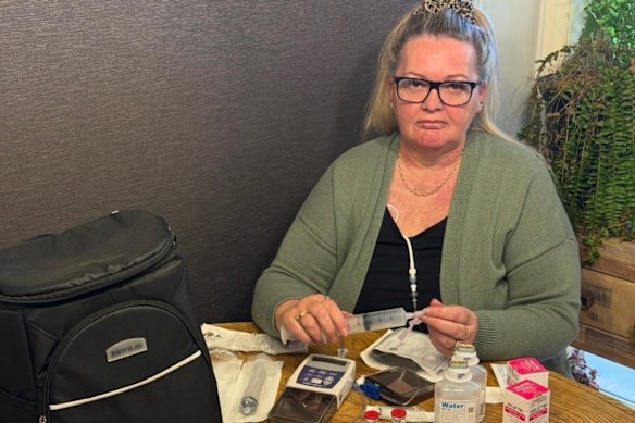 Tina Powney finds it difficult to leave the house because of the amount of medicine and equipment she must carry at one time. A drug that could change that is not available in Australia yet.