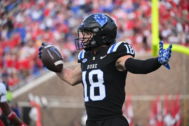 Sep 20, 2025; Durham, North Carolina, USA; Duke Blue Devils wide receiver Cooper Barkate (18) celebrates a touchdown during the third quarter against the NC State Wolfpack at Wallace Wade Stadium. Mandatory Credit: Zachary Taft-Imagn Images