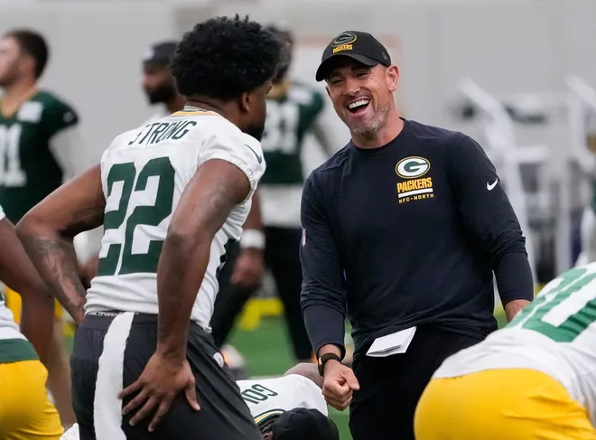 Green Bay Packers head coach Matt LaFleur shares a laugh with running back Pierre Strong Jr. (22) during practice on Wednesday, May 26, 2026, at the Don Hutson Center in Ashwaubenon, Wis.
Tork Mason/USA TODAY NETWORK-Wisconsin