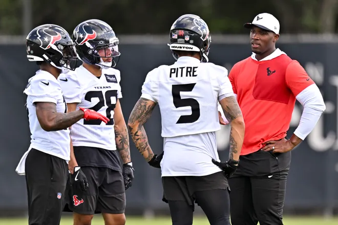 Jun 10, 2026; Houston, Texas, USA; Houston Texans head coach DeMeco Ryans speaks with safety Jalen Pitre (5) during the team’s minicamp at Houston Methodist Training Center. Mandatory Credit: Maria Lysaker-Imagn Images
