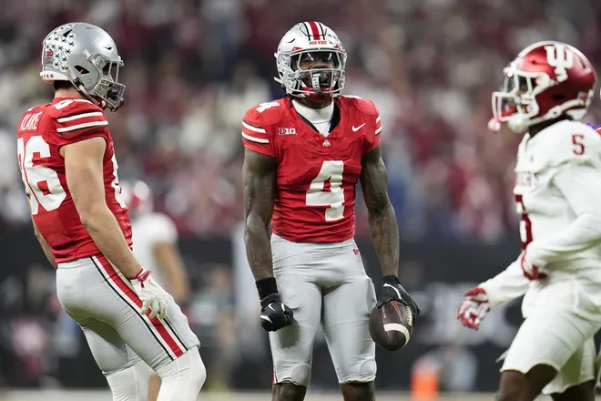 Ohio State Buckeyes wide receiver Jeremiah Smith (4) celebrates a catch during the first half of the Big Ten Conference championship game against the Indiana Hoosiers at Lucas Oil Stadium in Indianapolis on Dec. 6, 2025.