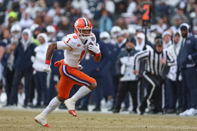 Dec 27, 2025; Bronx, NY, USA; Clemson Tigers wide receiver T.J. Moore (1) gains yards after catch during the first half of the 2025 Pinstripe Bowl against the Penn State Nittany Lions at Yankee Stadium. Mandatory Credit: Vincent Carchietta-Imagn Images