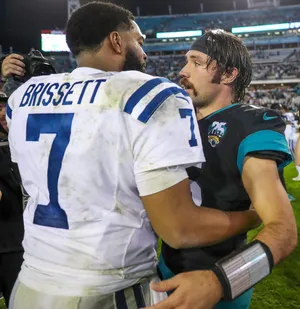 Indianapolis Colts quarterback Jacoby Brissett (7) and Jacksonville Jaguars quarterback Gardner Minshew II (15) briefly talk after the Colts' 38-20 loss against the Jaguars at TIAA Bank Field in Jacksonville, Fla., on Sunday, Dec. 29, 2019.