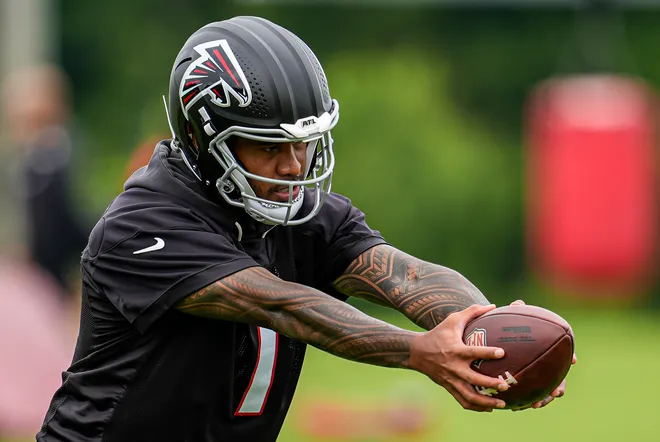 Atlanta Falcons quarterback Tua Tagovailoa (1) in action on the field during minicamp.