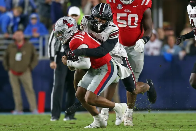 Nov 1, 2025; Oxford, Mississippi, USA; South Carolina Gamecocks defensive end Dylan Stewart (6) tackles Mississippi Rebels quarterback Trinidad Chambliss (6) during the second quarter at Vaught-Hemingway Stadium. Mandatory Credit: Petre Thomas-Imagn Images