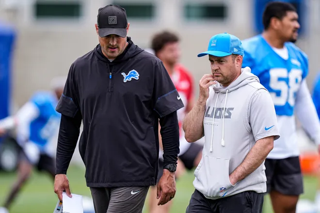 Detroit Lions pass game coordinator Mike Kafka, left, talks to offensive coordinator Drew Petzing during mini camp at Meijer Performance Center in Allen Park on Wednesday, June 17, 2026.