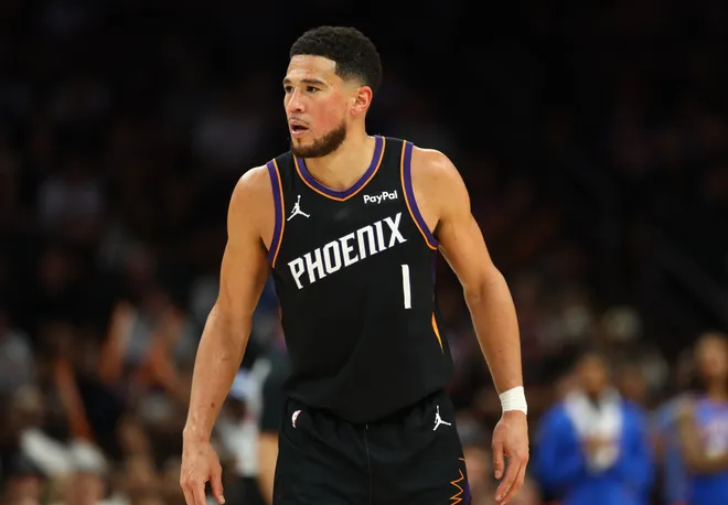 Apr 27, 2026; Phoenix, Arizona, USA; Phoenix Suns guard Devin Booker (1) against the Oklahoma City Thunder during game four of the first round of the 2026 NBA Playoffs at Mortgage Matchup Center. Mandatory Credit: Mark J. Rebilas-Imagn Images