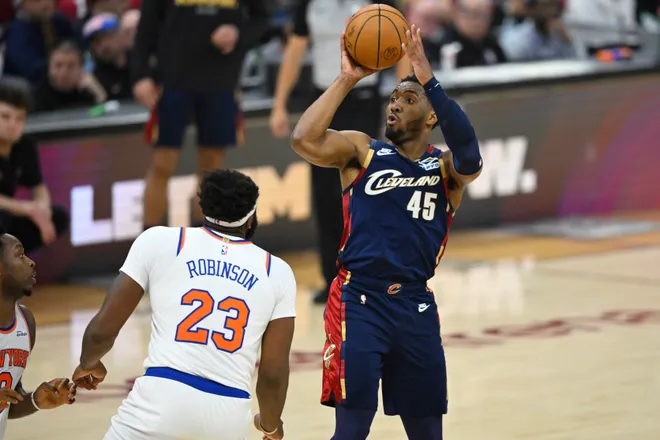 May 25, 2026; Cleveland, Ohio, USA; Cleveland Cavaliers guard Donovan Mitchell (45) shoots in the first quarter against the New York Knicks during game four of the eastern conference finals for the 2026 NBA playoffs at Rocket Arena. Mandatory Credit: David Richard-Imagn Images