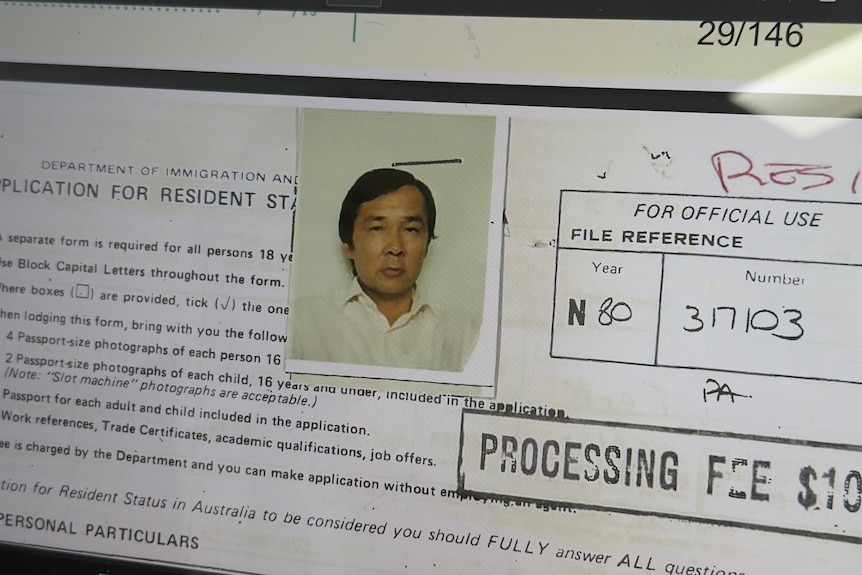 Papers with a man's photo.