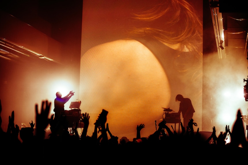 A band performs on a stage.