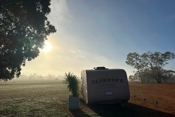 A caravan on a country property.