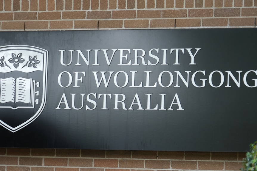 Sign with large circles saying UOW