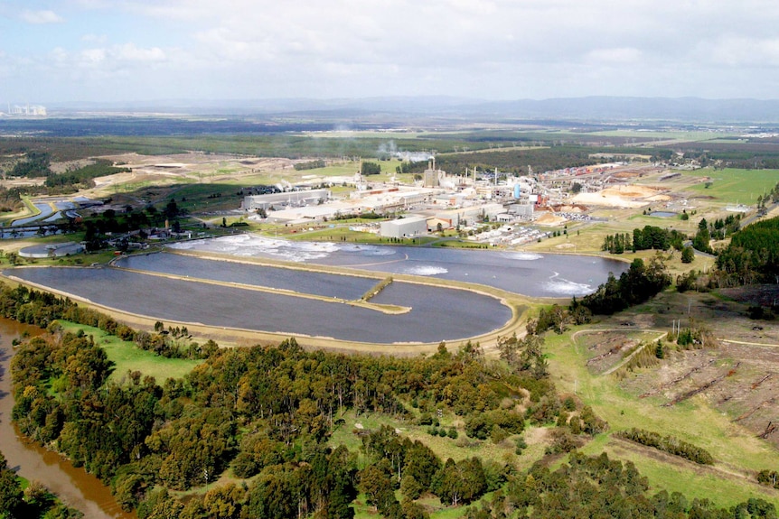 An aerial view of an industrial facility surrounded by rural land.
