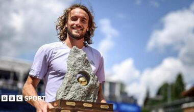 Stefanos Tsitsipas holds the Swiss Open trophy