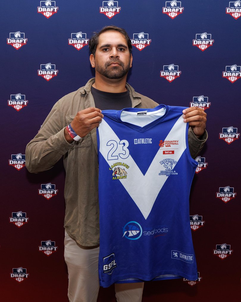 Lewis Jetta, who played for West Coast and Sydney, with a Royals jumper. 