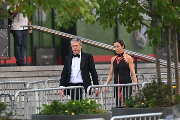 Hugh Grant and Anna Eberstein arrive at Madison Square Garden ahead of Swift and Kelce’s nuptials. 