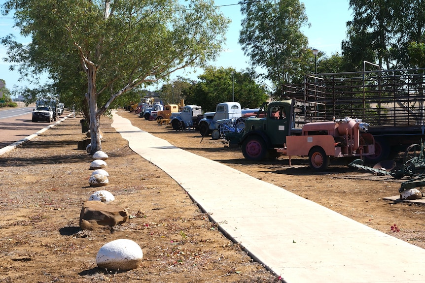 footpath with trucks lined up beside it