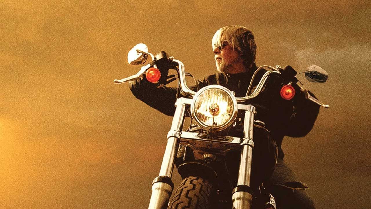 Bon Seger riding a motorbike as he appeared on the cover of Face The Promise