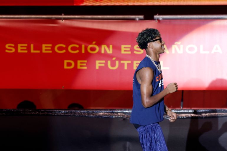 Spain's forward Lamine Yamal celebrates on a stage at Cibeles Square in Madrid on July 20, 2026, one day after winning their second World Cup title following a 1-0 victory against Argentina. Spain's World Cup winners come back home to a heroes' welcome in Madrid, where a million fans are expected to greet them after a night of raucous celebrations across the country. (Photo by Oscar DEL POZO / AFP)