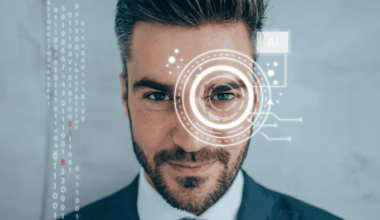 Man with virtual white circles on his eye and AI written on top, symbolising artificial intelligence.