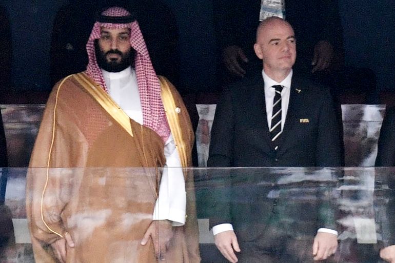 Saudi Arabia Crown Prince Mohammed bin Salman, left, and FIFA President Gianni Infantino stand for the anthem before the match between Russia and Saudi Arabia, which opened the 2018 World Cup