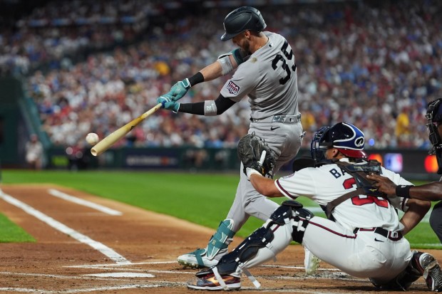 New York Yankees' Cody Bellinger hits a two-run single during the MLB baseball All-Star Game between the American League and National League, Tuesday, July 14, 2026, in Philadelphia. (AP Photo/Matt Rourke)