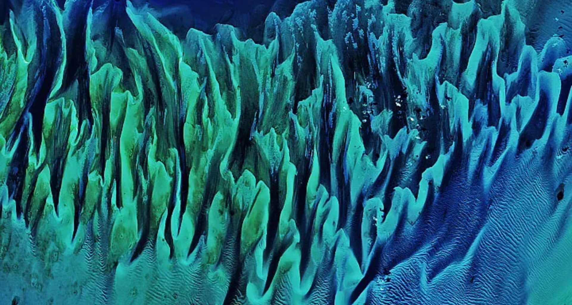 Colorful 'painting-like' ripples cover an ancient seafloor structure the Bahamas — Earth from space
