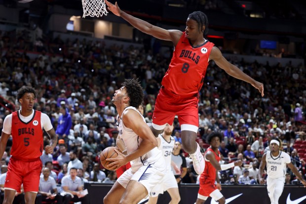 Bulls forward Caleb Wilson (8) jumps while defending Grizzlies forward Cameron Boozer during the first half of a summer league game Friday, July 10, 2026, in Las Vegas. (Ian Maule/AP)