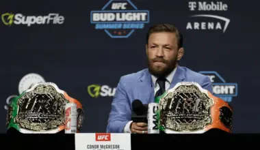Islam Makhachev smiles while being asked questions by a reporter